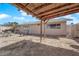 Large backyard with a covered patio, providing ample space for outdoor activities and potential landscaping at 5530 Berchmans Ave, Las Vegas, NV 89122
