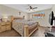 Spacious bedroom featuring a large bed, ceiling fan, and bright natural light at 5530 Berchmans Ave, Las Vegas, NV 89122