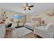 Bedroom with hardwood floors, ceiling fan, and natural light at 5530 Berchmans Ave, Las Vegas, NV 89122