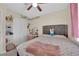 Cozy bedroom with natural light and light and bright walls at 5530 Berchmans Ave, Las Vegas, NV 89122