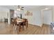 Cozy dining area features wood floors and a dining set, perfect for Gathering meals and gatherings at 5530 Berchmans Ave, Las Vegas, NV 89122