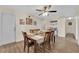 The dining room has a neutral color scheme with a wooden table set perfect for Gathering meals at 5530 Berchmans Ave, Las Vegas, NV 89122