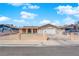 Charming single-story home with a spacious front yard and white wrought iron fence at 5530 Berchmans Ave, Las Vegas, NV 89122