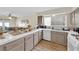 Spacious kitchen with tiled countertops and a view of the living area, designed for both cooking and entertaining at 5530 Berchmans Ave, Las Vegas, NV 89122