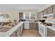 Well-lit kitchen featuring tiled countertops and modern appliances, offering a functional and stylish cooking space at 5530 Berchmans Ave, Las Vegas, NV 89122