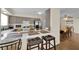 A well-lit kitchen bar top with stainless steel appliances and an open dining area at 5530 Berchmans Ave, Las Vegas, NV 89122