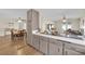 Bright kitchen featuring tile countertops, modern appliances, and an open layout at 5530 Berchmans Ave, Las Vegas, NV 89122