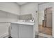 Laundry room including washer and dryer with shelving above machines at 5530 Berchmans Ave, Las Vegas, NV 89122