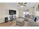 Comfortable living room featuring a plush sectional sofa and a sliding glass door to the exterior at 5530 Berchmans Ave, Las Vegas, NV 89122