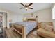 Comfortable main bedroom with closet, side chair, and wood-look flooring at 5530 Berchmans Ave, Las Vegas, NV 89122