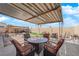 Inviting outdoor patio with stylish wicker furniture, ideal for relaxing and enjoying the beautiful backyard at 5530 Berchmans Ave, Las Vegas, NV 89122