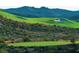 Picturesque golf course with lush green fairways and scenic mountain views at 557 Overlook Rim Dr, Henderson, NV 89012
