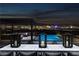 Stunning infinity pool offers breathtaking panoramic city views, as well as adjacent outdoor lounge area at 557 Overlook Rim Dr, Henderson, NV 89012