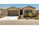 Charming single-story home with a two-car garage and desert landscaping, perfect for low-maintenance living at 5635 E La Campana Dr, Pahrump, NV 89061