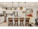 Bright kitchen featuring an island with bar seating and stainless steel appliances at 5635 E La Campana Dr, Pahrump, NV 89061