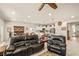 Spacious living room flowing into an open kitchen with modern appliances and sleek countertops at 5635 E La Campana Dr, Pahrump, NV 89061