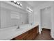 Bathroom features dual sinks, a large mirror, and a separate toilet room at 6150 W Brooks Ave, Las Vegas, NV 89108