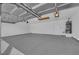 Clean, spacious garage with ample room for parking and storage, featuring a water heater at 6150 W Brooks Ave, Las Vegas, NV 89108