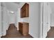 Hallway with custom storage cabinets and neutral paint at 6150 W Brooks Ave, Las Vegas, NV 89108