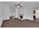 Bright living room featuring a brick fireplace, wood-style flooring, and ample natural light at 6150 W Brooks Ave, Las Vegas, NV 89108