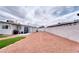 Open backyard with gravel landscaping, turf, storage shed, and outdoor grilling area at 6232 Bristol Way, Las Vegas, NV 89107