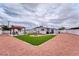Large backyard featuring low maintenance landscaping and an outdoor seating area at 6232 Bristol Way, Las Vegas, NV 89107