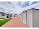 Spacious backyard featuring a storage shed, rock landscape and some grass at 6232 Bristol Way, Las Vegas, NV 89107