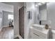 Bathroom featuring vessel sink, shower with curtain, and wood-style flooring at 6232 Bristol Way, Las Vegas, NV 89107