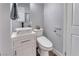 Bathroom featuring vessel sink, modern toilet, and wood-style flooring at 6232 Bristol Way, Las Vegas, NV 89107