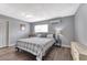Cozy bedroom featuring wood floors, a comfortable bed, and soft natural light from the window at 6232 Bristol Way, Las Vegas, NV 89107