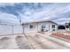 Exterior of a well-maintained one-story home with a gated driveway and desert landscaping at 6232 Bristol Way, Las Vegas, NV 89107
