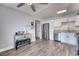 Well-lit kitchen with stainless steel appliances, granite countertops, and wood-look flooring at 6232 Bristol Way, Las Vegas, NV 89107