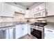 Updated kitchen featuring stainless steel appliances, subway tile backsplash and stylish cabinetry at 6232 Bristol Way, Las Vegas, NV 89107