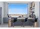Contemporary bar area with sleek countertops, stylish seating, and stunning city views at 667 Palisade Rim Dr, Henderson, NV 89012