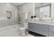 Elegant bathroom with a glass-enclosed shower/tub, stylish vanity, and modern fixtures at 667 Palisade Rim Dr, Henderson, NV 89012