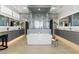 Luxurious bathroom with a soaking tub, glass shower, and dual vanities at 667 Palisade Rim Dr, Henderson, NV 89012
