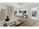 Spacious bedroom with a seating area, large windows, and a view of the outdoors at 667 Palisade Rim Dr, Henderson, NV 89012