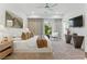 Bright bedroom features stylish decor, neutral tones, and a cozy textured throw blanket at 667 Palisade Rim Dr, Henderson, NV 89012