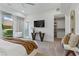 Serene bedroom with a view of the outdoors, ample lighting, and a walk-in closet at 667 Palisade Rim Dr, Henderson, NV 89012