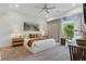 Inviting bedroom featuring modern design, warm accents, and natural light from the window at 667 Palisade Rim Dr, Henderson, NV 89012