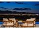 Stunning Las Vegas city view from the outdoor seating area at night at 667 Palisade Rim Dr, Henderson, NV 89012