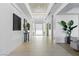 Bright and airy foyer with modern decor, tiled floors, and a unique ceiling design at 667 Palisade Rim Dr, Henderson, NV 89012