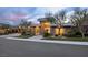 Contemporary home with stylish architecture, lush landscaping, and inviting curb appeal at 667 Palisade Rim Dr, Henderson, NV 89012