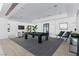 Spacious game room with a billiard table, modern decor, and comfortable seating areas at 667 Palisade Rim Dr, Henderson, NV 89012
