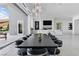 Open-concept great room with dining area, living space, and sliding doors to the outdoor space at 667 Palisade Rim Dr, Henderson, NV 89012