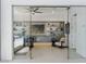 Modern home office with glass doors, built-in shelving, stylish decor, and comfortable seating at 667 Palisade Rim Dr, Henderson, NV 89012