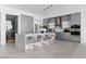 Modern kitchen featuring gray cabinetry, a center island with seating, and a wine refrigerator at 667 Palisade Rim Dr, Henderson, NV 89012