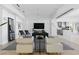 Open living space with a game room, seating, and a view of the modern kitchen at 667 Palisade Rim Dr, Henderson, NV 89012