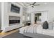 Spacious bedroom featuring a fireplace, TV, and ensuite bathroom at 667 Palisade Rim Dr, Henderson, NV 89012
