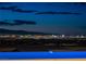 Breathtaking night view of the city lights and skyline, viewed from this home's scenic property at 667 Palisade Rim Dr, Henderson, NV 89012